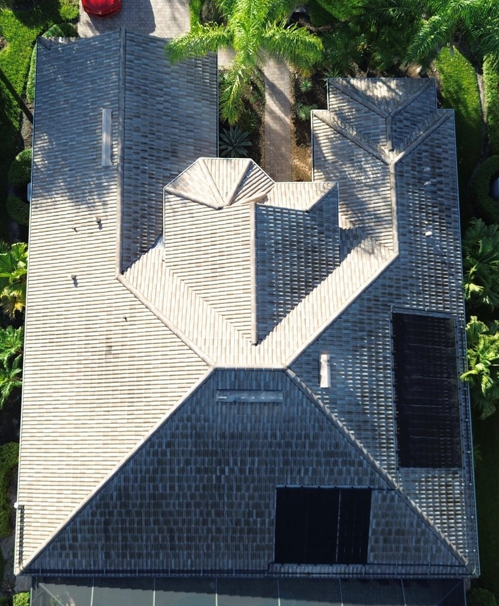Second roof before cleaning, showing algae and dark streaking